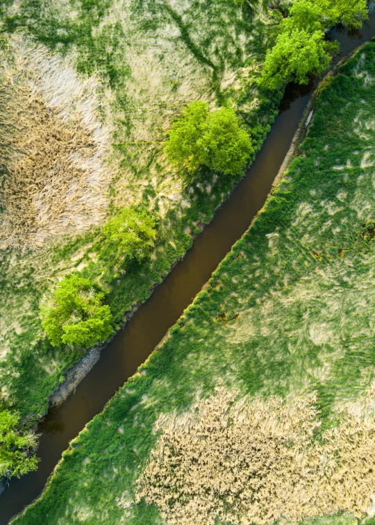 an aerial view of the river that runs through a valley