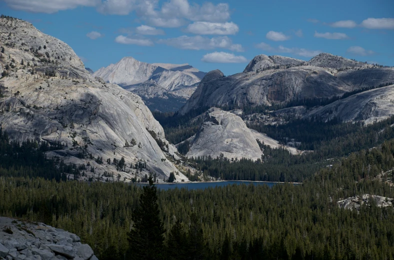 the mountains surrounding a large mountain lake