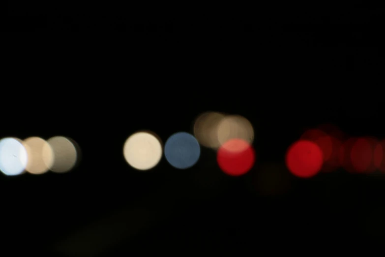 an blurry image of a stop light at night