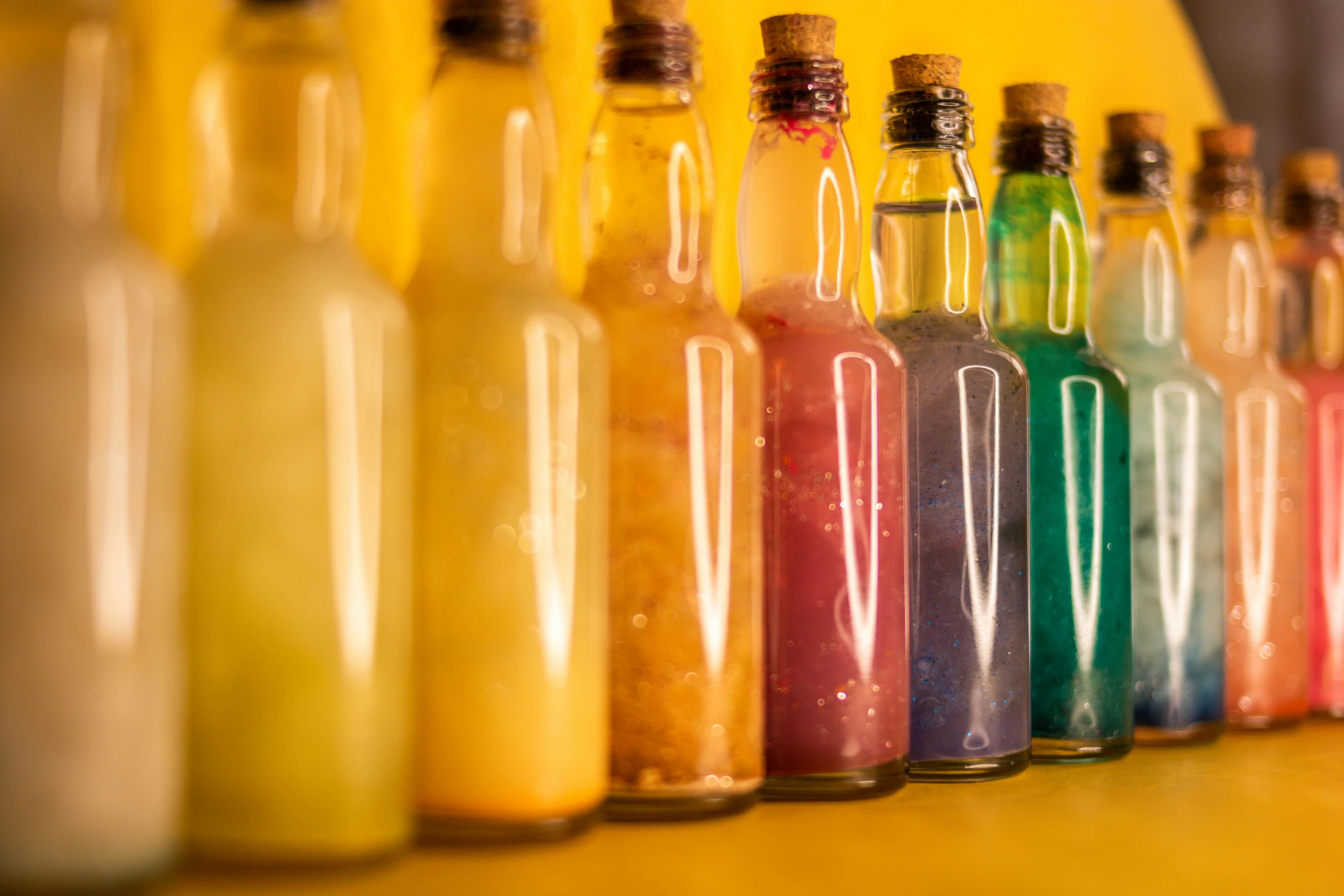 the colorful jars of various liquid are lined up