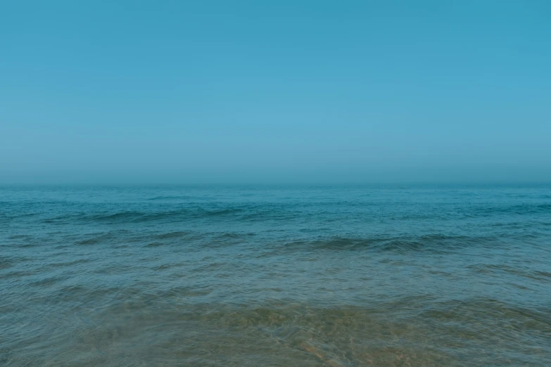 the ocean is very clear and blue in color