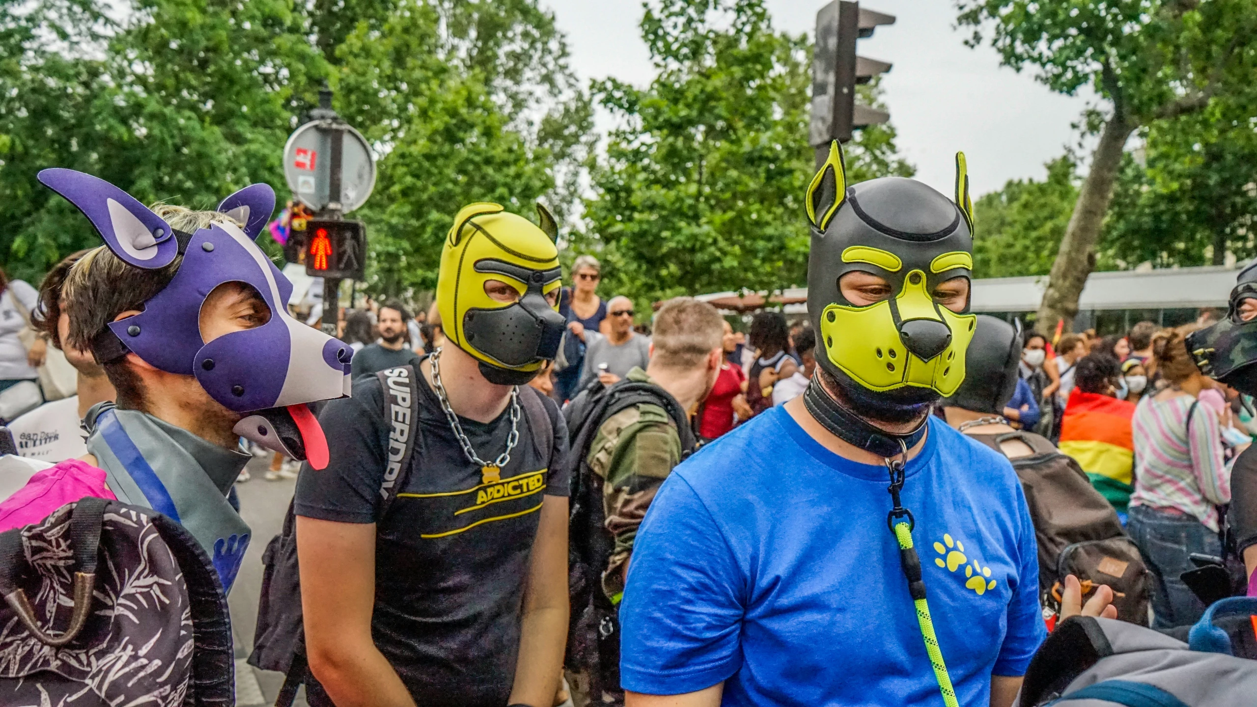 several people wearing masks on their faces at an event