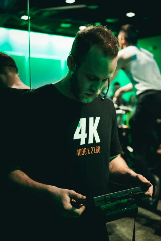 a man standing in front of a green screen