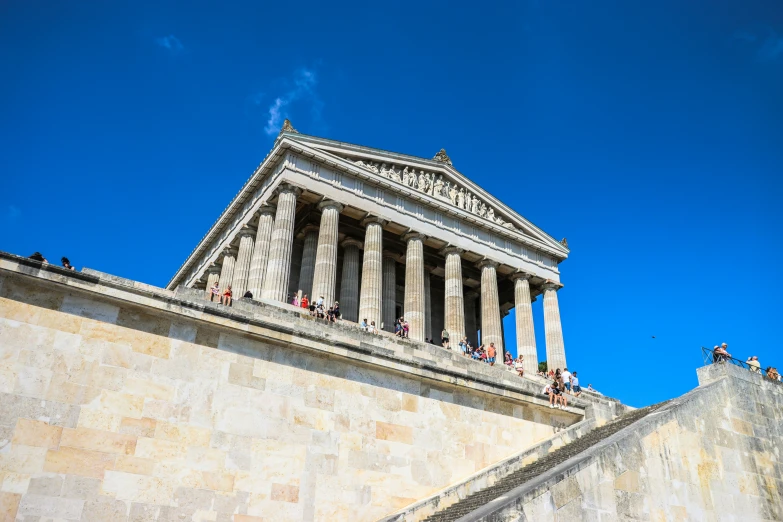 two tall pillars with statues on them at the top