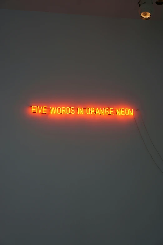 a neon sign that says five words in orange neon