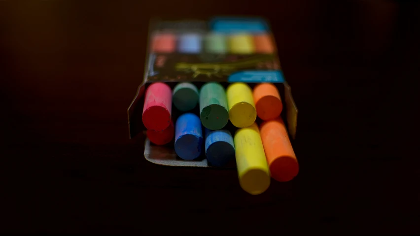 a box of crayons in bright colors