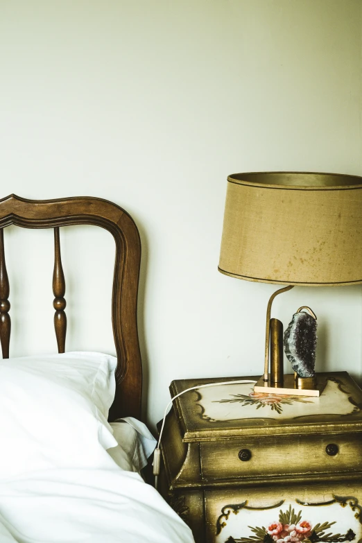 a bed with a wooden headboard and two lamps