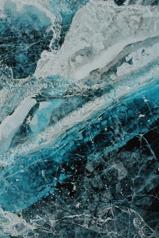 a close up of some ice with blue colors