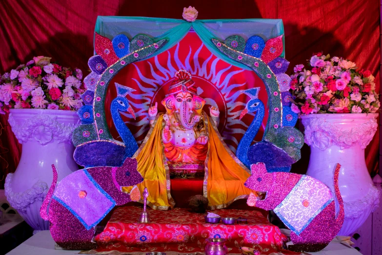 a man sitting in front of a decorated bench