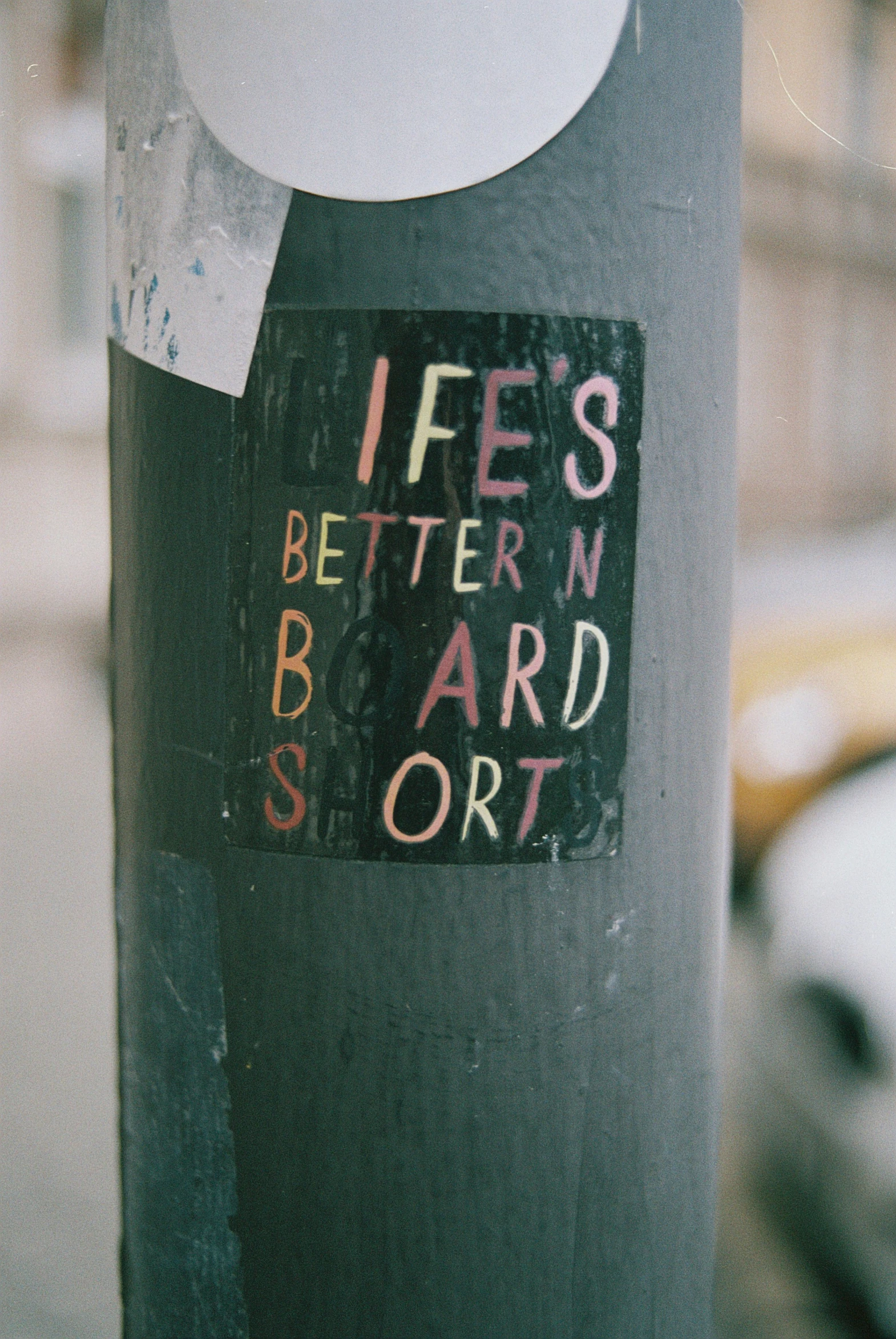 a closeup of a street pole with a magnet attached