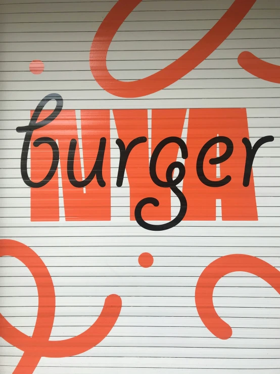 the word burger is painted on a closed garage door