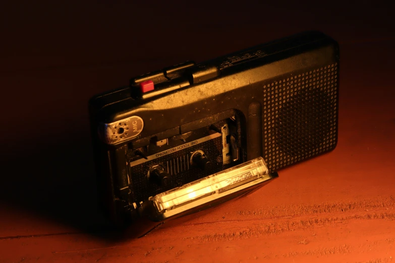 old looking radio sitting on a table with the sun shining