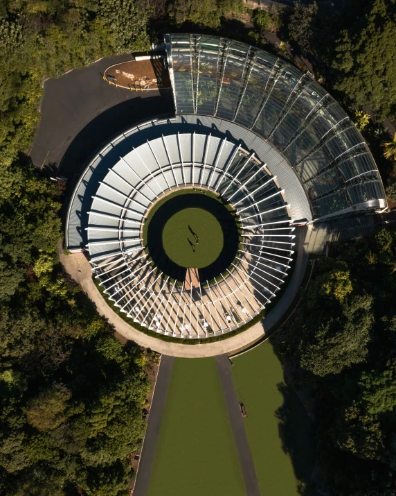 a bird's eye view of the circular structure in a forest