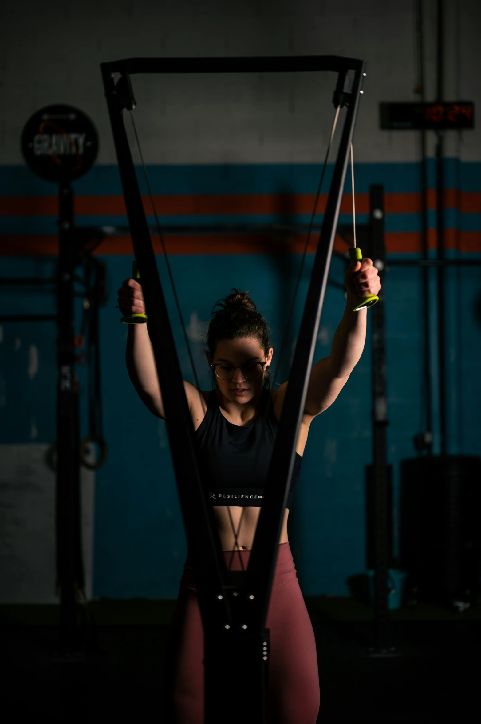 a woman is holding on to her crossbars