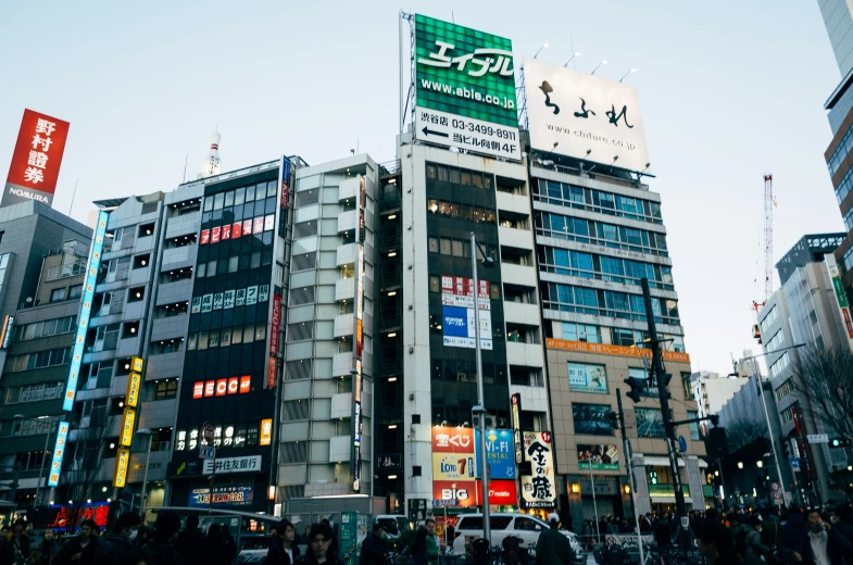 city street with multiple asian business buildings in the distance