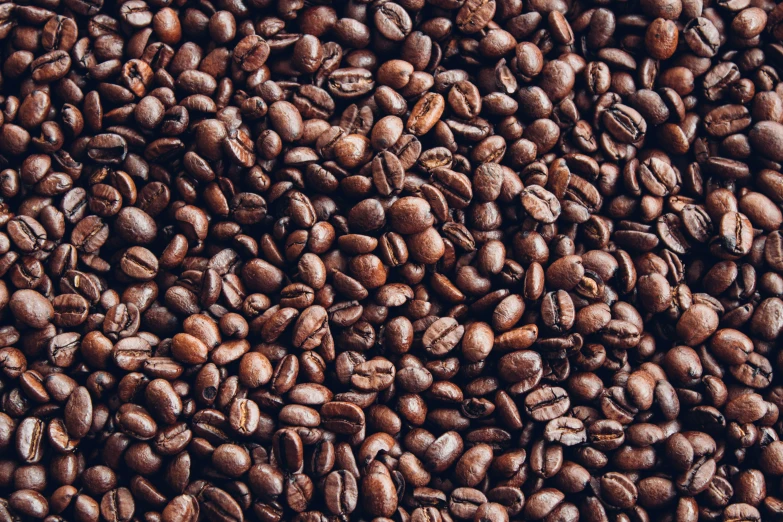 coffee beans on top of each other in a pile