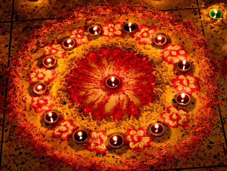 a circular decoration of silver objects and candles