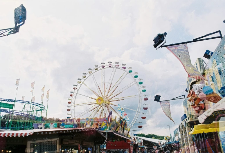 a carnival has several rides and large flags