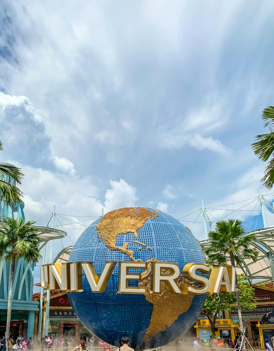 the entrance to universal studios, with the name on the globe