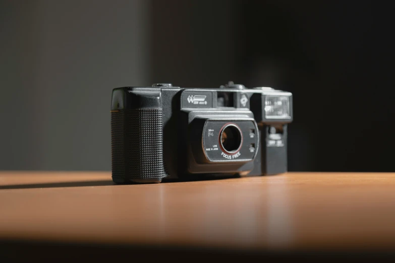 a brown and black camera on wooden table