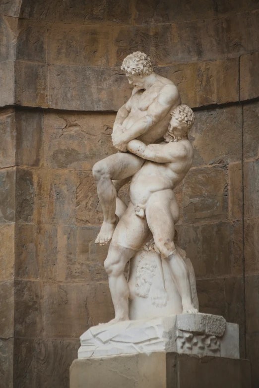 a statue in the shape of two men emcing