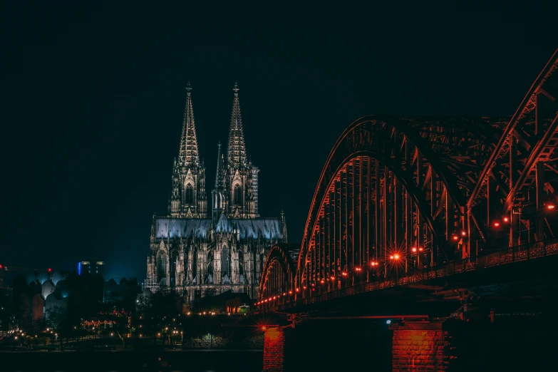 cologne castle in germany at night as seen from across the river