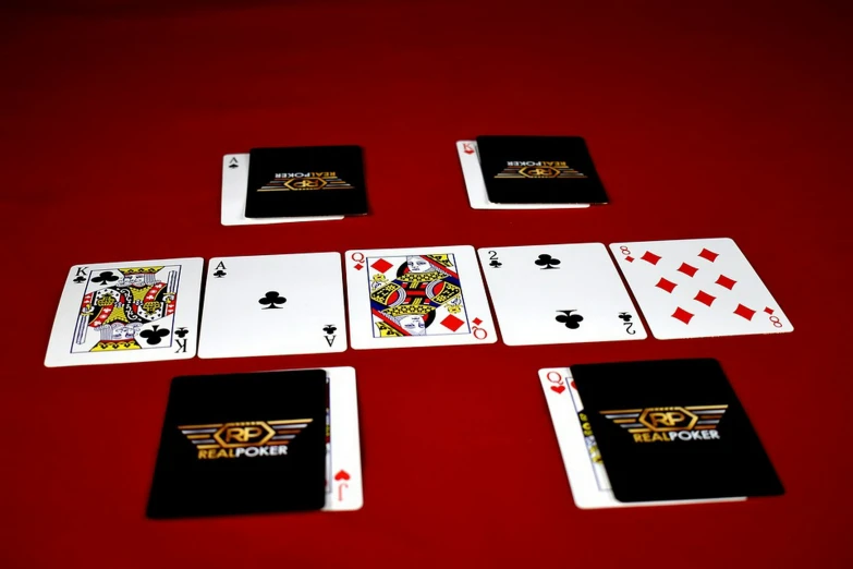 four deck cards sitting on top of each other