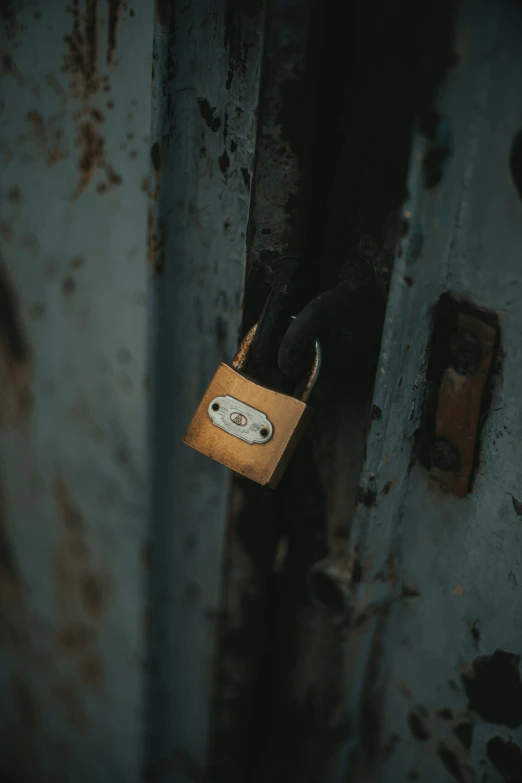 a wooden padlock is holding onto an old door