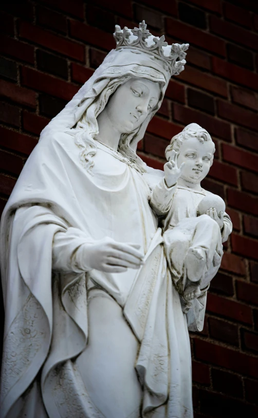 statue with the virgin mary holding a baby jesus