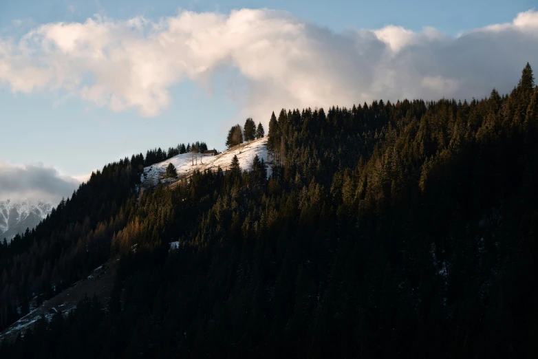 a view of the mountains during sunset in the mountains