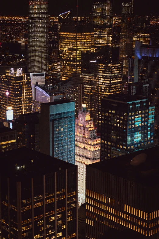 the lights on this building give the city's skyline a dark backdrop