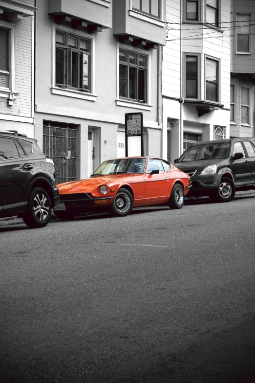 two cars are parked on the side of a road