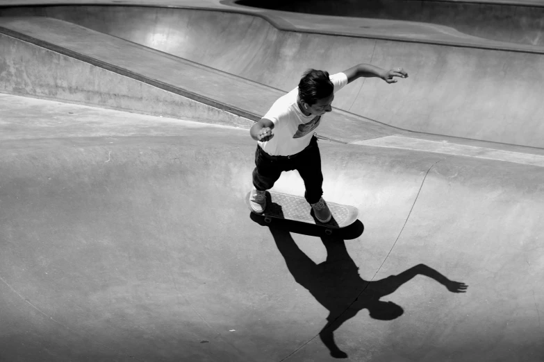 a man riding a skateboard up the side of a ramp