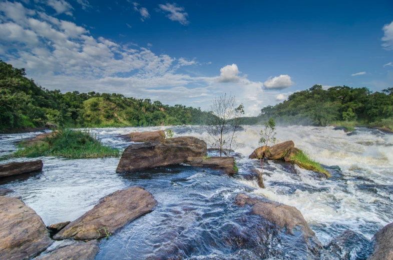 a river has large rocks surrounding it