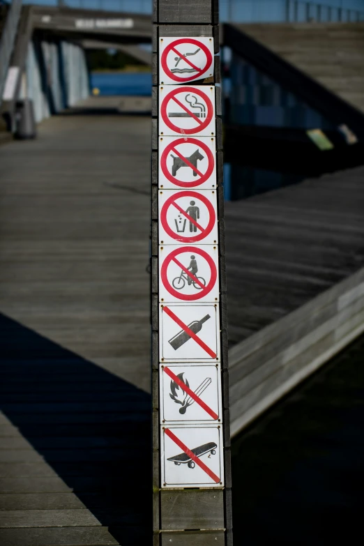 a sign is standing on the dock with its own name