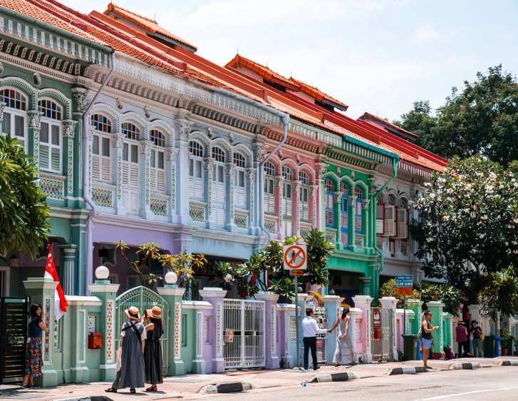 an image of people standing outside of a building