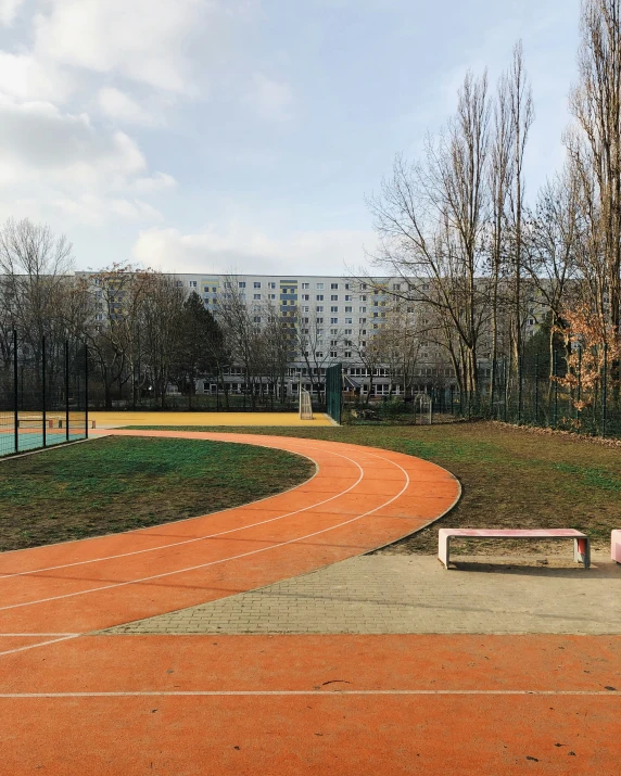 a pathway that is next to a bench