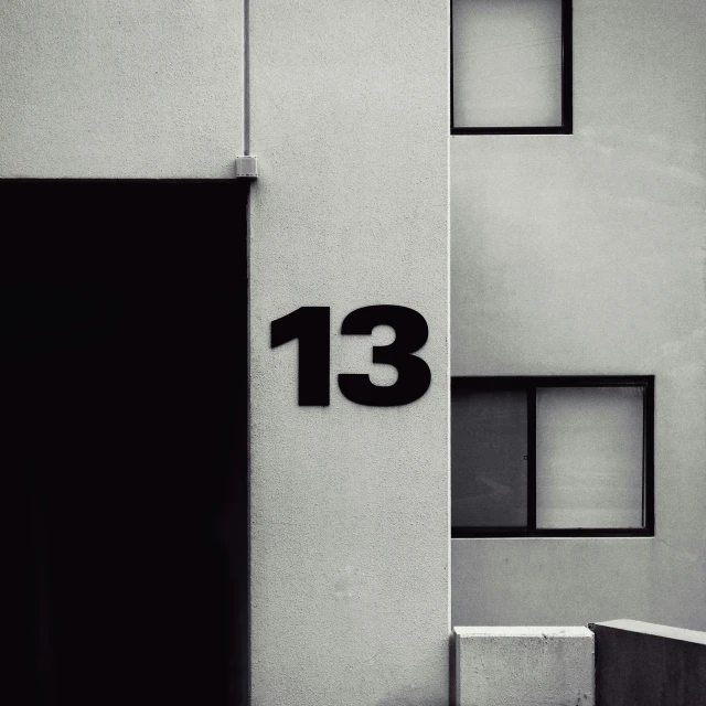 the number thirteen is written on the side of a building