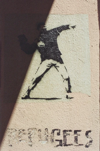 a black and white po of the person on a skateboard in front of a wall