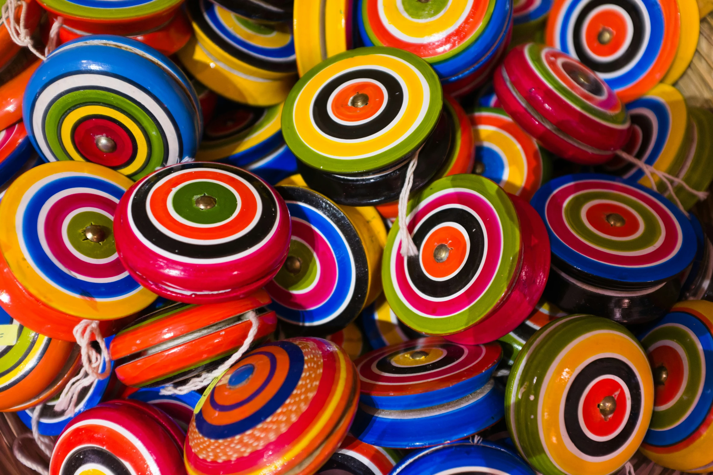 a pile of colorful hand made ons on display