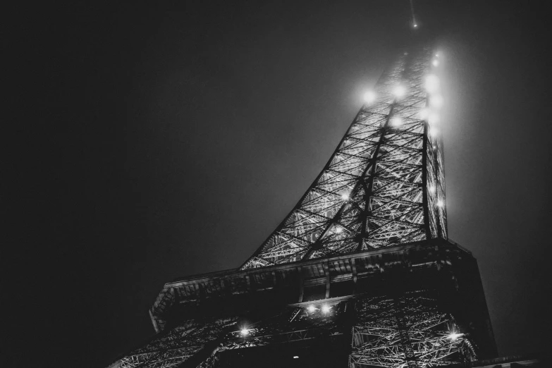 the top of the eiffel tower is lit up