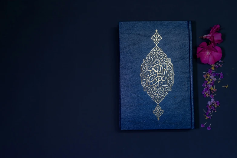 a close up of a blue book with flowers
