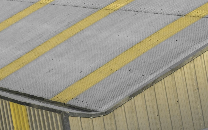 the floor of an airplane platform has yellow lines