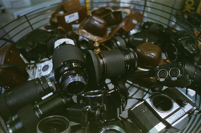 this is a large metal container filled with many different cameras