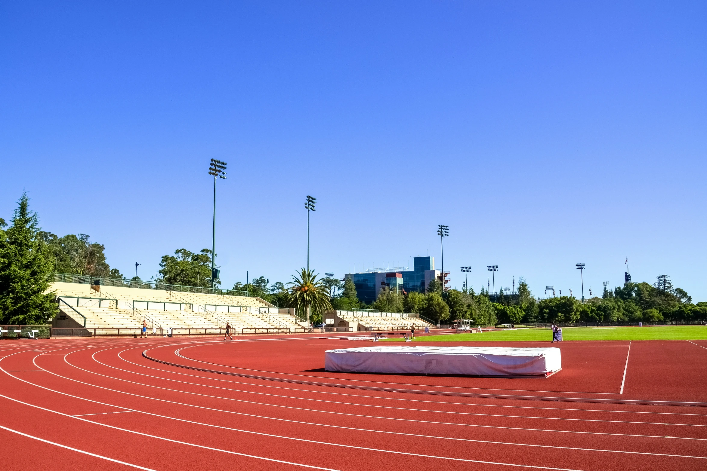 a race track with a white blanket and stands near a stadium