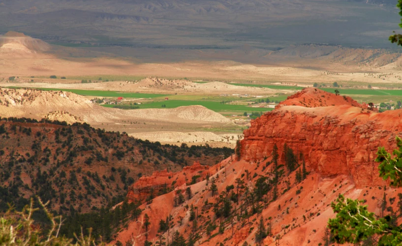 the view from an overlook in a hilly area