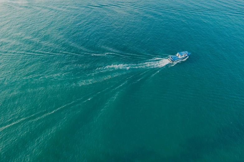 an ocean with a boat sailing in it