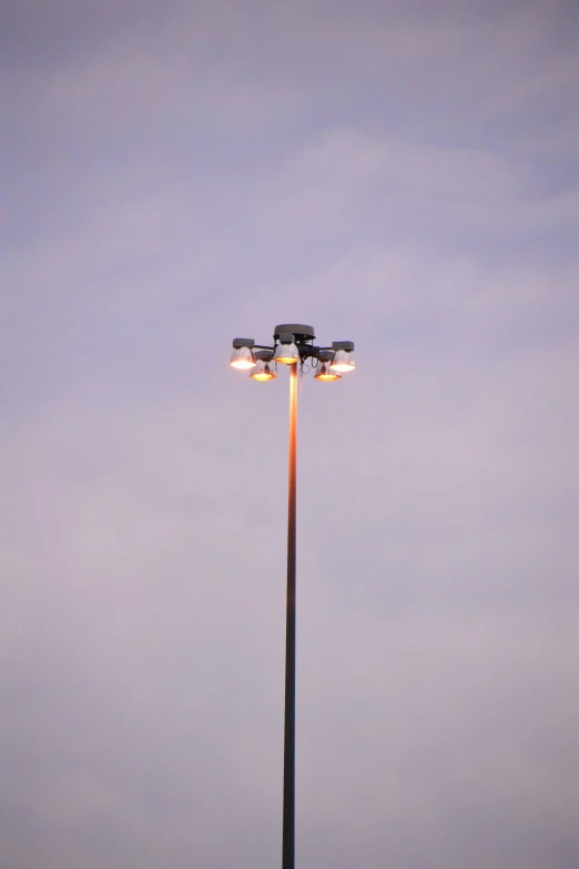 a couple of lights on the top of a pole