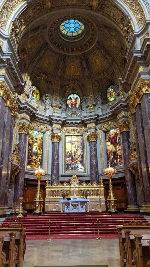 a building with statues and paintings hanging above the chapel