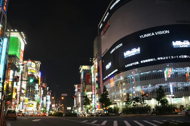 several large buildings lit up with bright lights